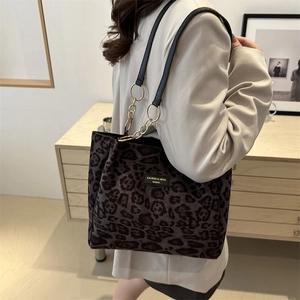 Fashionable leopard print tote bag for women with gold chain detail and shoulder strap