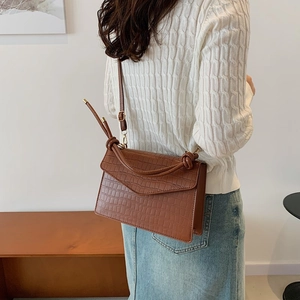 Brown crocodile embossed small square bag with unique knot handle and crossbody strap