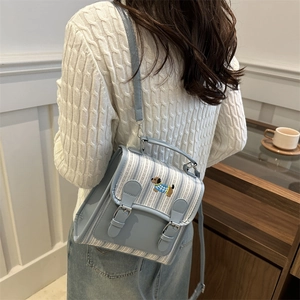 Blue striped aesthetic backpack with dog embroidery and vintage buckle straps