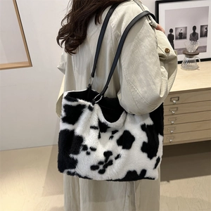 Vintage cow print plush shoulder tote bag with black straps for autumn fashion