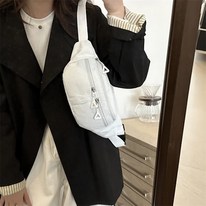Minimalist white corduroy chest bag for women with multiple zippers and wide strap
