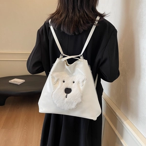 Cute white PU leather backpack with plush schnauzer dog patch worn by model
