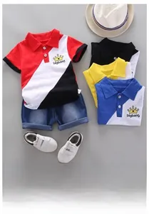 Detail view of cotton polo shirt with crown print and contrast color stitching style