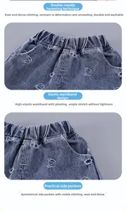 Detail of girls' blue denim shorts with bear embroidery, elastic waist and side pockets