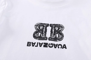 Close-up of white cotton T-shirt featuring vintage black logo print and graphic details
