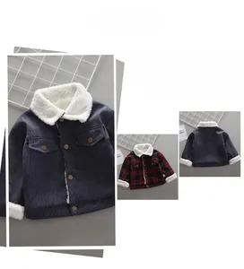 Detail of velvet lined corduroy jacket with metal buttons and plaid pattern accents