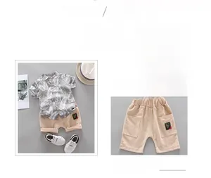 Detail of boys' palm leaf print shirt and khaki shorts with large utility pockets