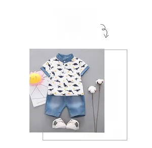 Detail of boys summer set with dinosaur print polo shirt and denim shorts