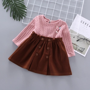 Pink knit sweater with flower pearls and brown skirt set for girls shown in flat lay