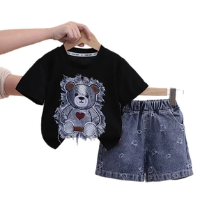 Cute girls summer set with black bear patch T-shirt and washed denim printed shorts