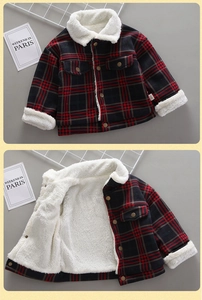 Detail of red checkered kids jacket featuring warm fleece lining and buttoned chest pockets