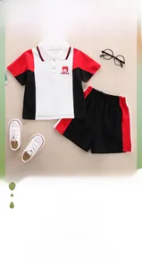 Detailed flat lay of soft cotton kids polo shirt and shorts set with bear embroidery