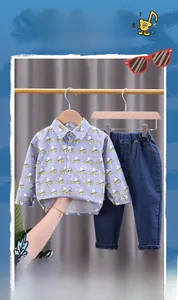 Detail of toddler boy set showing light blue lightning print shirt and denim jeans