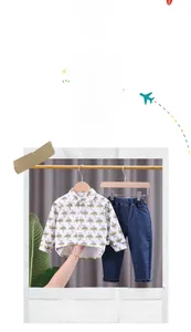 Detail of toddler boy set with thunderbolt print shirt and dark blue denim jeans