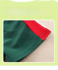 Detail showing flat double-stitched seams and breathable mesh fabric on kids' polo set