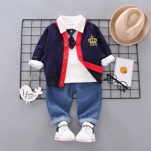 Three-piece boy clothing set with navy cardigan, white shirt and blue denim pants