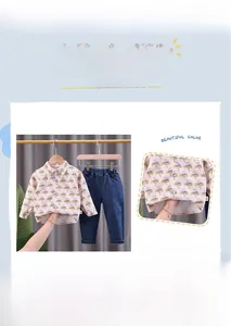 Detail of pink long sleeve shirt with lightning patterns and blue denim pants for boys