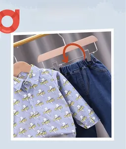 Detail view of boys light blue cat print shirt with comfortable elastic waist jeans