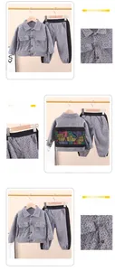 Detailed view of children's grey houndstooth jacket and pants set with back graphic