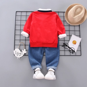 Three-piece boys' casual set with red sweatshirt, denim jeans and white sneakers