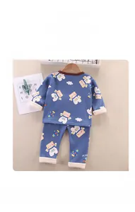 Detail of space-themed kids warm thermal pajamas with bear and rocket prints