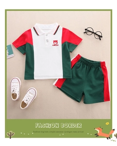 Detailed flat lay of children's cotton polo shirt and shorts set with red bear logo
