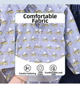 Detail of soft cotton fabric with lightning and PWR print on toddler long sleeve shirt