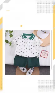 Detail of knit cotton polo with palm tree print and elastic green shorts for toddler boys