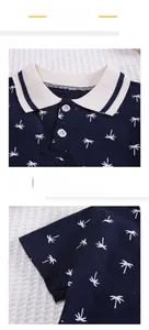 Detail of dark blue polo shirt with palm tree print and striped knit collar