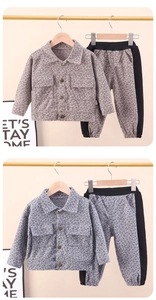 Detail of children's grey checkered jacket and joggers set with stylish pocket design