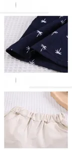 Detail of boys navy coconut print sleeve and elastic waist shorts with cotton texture