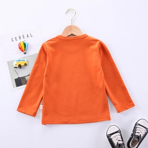 T-shirt manches longues orange vif en coton pour garçon avec col rond sur cintre
