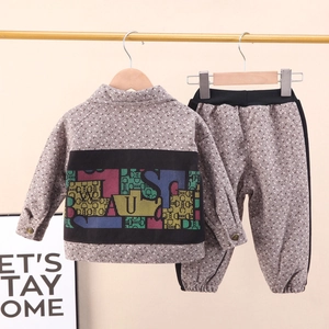 Kids plaid two-piece set featuring a trendy graphic jacket and elastic waist joggers