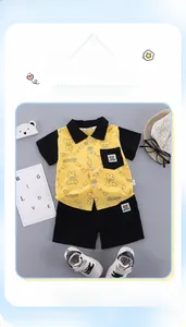 Detailed flat lay of boys' summer set with yellow cartoon shirt and black shorts