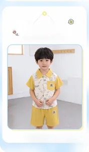 Detail of boys yellow cotton set showing anti-wrinkle fabric and cartoon bear prints