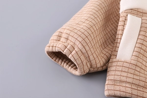 Detail of waffle knit fabric and ribbed elastic cuffs on kids winter thermal set