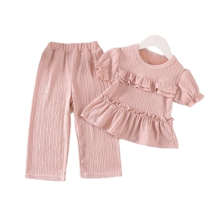 Pink girl's two-piece summer set with ruffled short sleeves and pleated wide-leg pants