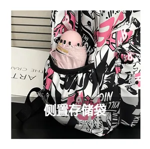 Detail of backpack side elastic pocket showing storage for a pink capsule umbrella