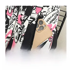 Detail of a hidden anti-theft back zipper pocket on graffiti backpack holding a phone