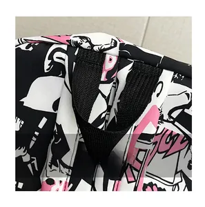 Detail of reinforced black handle on a stylish backpack with colorful anime print