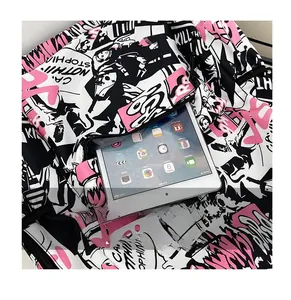 Front zipper pocket of graffiti backpack showing storage space for a tablet device