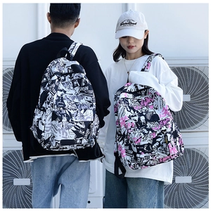 Detail shot of graffiti canvas backpacks with 'KILL THE NIGHT' print on adjustable straps