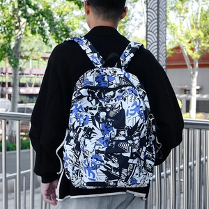 Men's stylish backpack with blue comic graffiti print and KILL THE NIGHT text in street setting