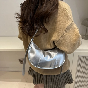 Metallic silver crescent underarm bag for women with adjustable strap and sleek design