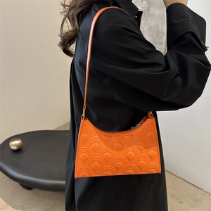 Minimalist orange crescent shoulder bag with fish scale pattern on textured PU leather