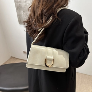 Minimalist beige underarm shoulder bag with luxury gold U-shaped metal buckle for women