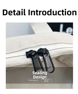 Detailed close-up of smooth double black metal zippers on minimalist backpack closure