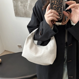 Minimalist white woven leather crescent handbag for women in casual street style fashion