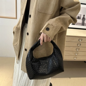 Chic black woven leather hobo bag for women with an elegant crescent shape for daily style
