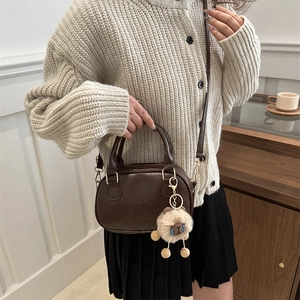 Retro dark brown PU leather crossbody bag with letter embossing and plush charm accessory